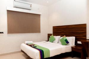 Postel nebo postele na pokoji v ubytování HOTEL GOLDEN TULIPZ