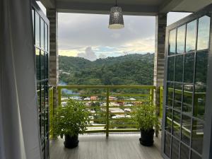 a balcony with a view of a city at Villa Nola in Port-of-Spain