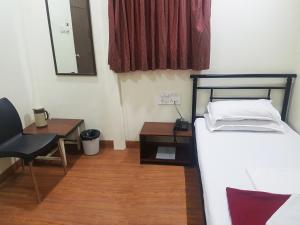 Postel nebo postele na pokoji v ubytování Hotel Kumkum