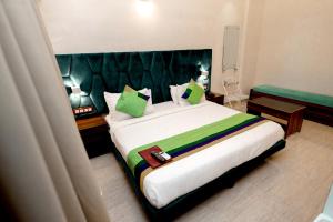 Postel nebo postele na pokoji v ubytování HOTEL GOLDEN TULIPZ