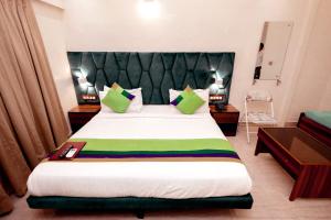 Postel nebo postele na pokoji v ubytování HOTEL GOLDEN TULIPZ