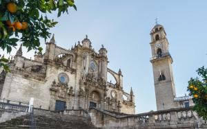 an old church with two towers and stairs at Limehome Jerez de la Frontera Marqués de Casa-Domecq in Jerez de la Frontera