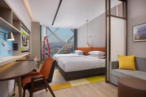 Voodi või voodid majutusasutuse Home2 Suite by Hilton Chongqing Wanzhou toas