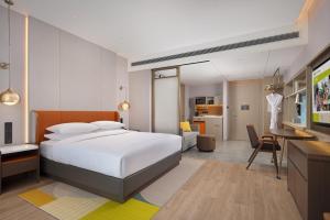 Voodi või voodid majutusasutuse Home2 Suite by Hilton Chongqing Wanzhou toas
