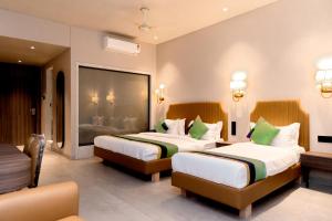 Postel nebo postele na pokoji v ubytování HOTEL GOLDEN TULIPZ