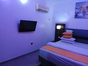Ένα ή περισσότερα κρεβάτια σε δωμάτιο στο Crownedge Hotels