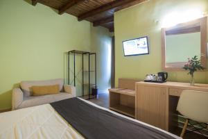 TV a/nebo společenská místnost v ubytování Hotel Leto Delphi