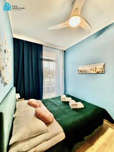 En eller flere senge i et værelse på Pod Brzozami Apartamenty Ku Morzu + 218 billeder