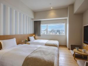 Postel nebo postele na pokoji v ubytování Hiroshima Washington Hotel + 37 fotografií