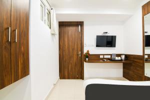 TV a/nebo společenská místnost v ubytování Super Hotel O Eminent Hotel