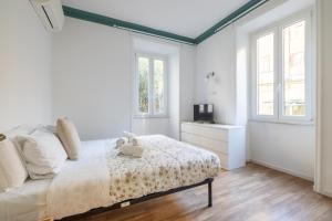 A bed or beds in a room at VATICAN COZY APARTMENT - GIULIANA