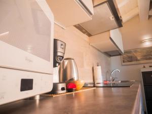 A kitchen or kitchenette at Maison Tatà
