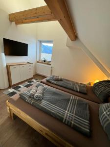 Posteľ alebo postele v izbe v ubytovaní Haus Kampl - Appartement Grundlsee