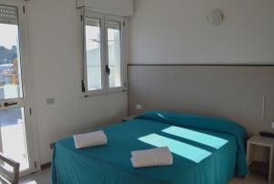 Postel nebo postele na pokoji v ubytování Hotel Caesar