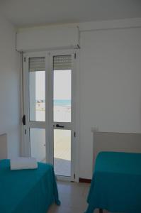Postel nebo postele na pokoji v ubytování Hotel Caesar