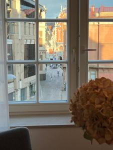 a window with a view of a city street at Suite Nr 5 - J26 LUXURY APARTHOTEL, Jauniela 26 Old Riga - Great View & Top Location - 2 Bedrooms - 80 m2 in Rīga