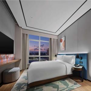 Postel nebo postele na pokoji v ubytování Hilton Garden Inn Beijing Yizhuang
