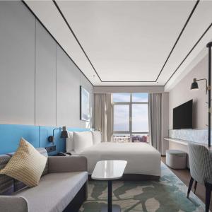 TV a/nebo společenská místnost v ubytování Hilton Garden Inn Beijing Yizhuang