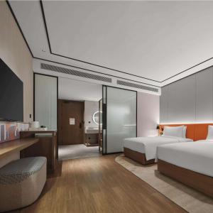 Postel nebo postele na pokoji v ubytování Hilton Garden Inn Beijing Yizhuang