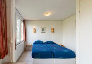 Postel nebo postele na pokoji v ubytování Bungalowpark Simpelveld - Delta 148