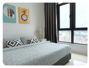 a bedroom with a bed and a large window at Tropicana Suite in Petaling Jaya +44 photos