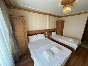Postel nebo postele na pokoji v ubytování Delbab PANSİYON