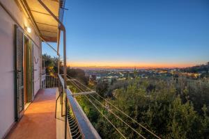 a balcony of a house with a view of the city at Belvedere Centro di Ariccia in Ariccia