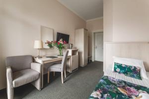 TV a/nebo společenská místnost v ubytování Hotel Amalia