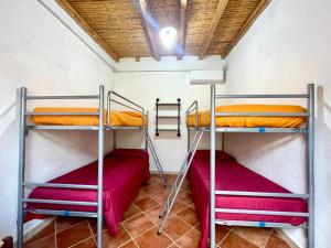 Postel nebo postele na pokoji v ubytování Su Barraccu Del Golgo