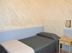 Postel nebo postele na pokoji v ubytování Nouvel Hotel Des Bains