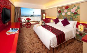 Televiisor ja/või meelelahutuskeskus majutusasutuses Hotel Riviera Macau