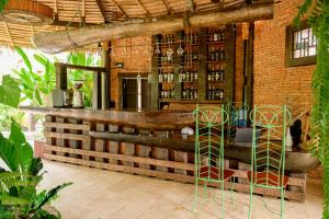 a bar in a building with a brick wall at Earth Elements Eco Resort in Ban Bu Hua Chang