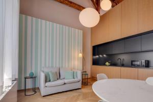 a living room with a couch and a table at Rambaldi Apartments Casa nr 7 in Bardolino