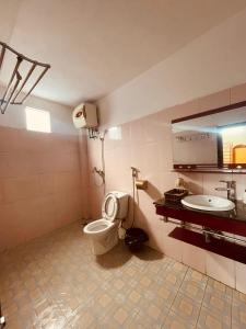 a bathroom with a toilet and a sink at Sapa Family Homestay in Sa Pa +55 photos
