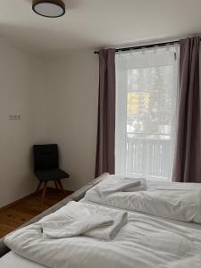Posteľ alebo postele v izbe v ubytovaní Stubnerkogel Apartments