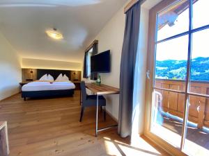 Voodi või voodid majutusasutuse Berghotel Alpenklang toas