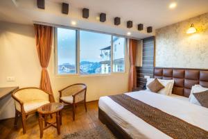Postel nebo postele na pokoji v ubytování Jai Hotels + 37 fotografií