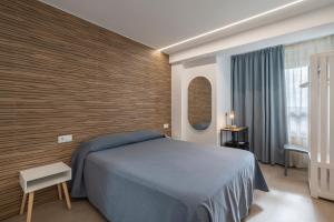Postel nebo postele na pokoji v ubytování Hostal Pensimar