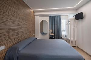 Postel nebo postele na pokoji v ubytování Hostal Pensimar