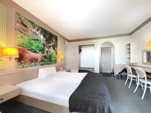 Postel nebo postele na pokoji v ubytování WAGNERS Hotel Schönblick, C&C Hotels und Vertrieb GmbH