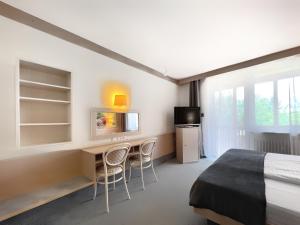 Postel nebo postele na pokoji v ubytování WAGNERS Hotel Schönblick, C&C Hotels und Vertrieb GmbH