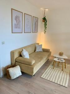 a living room with a couch and a table at Apartment Panoramablick in Bad Mergentheim