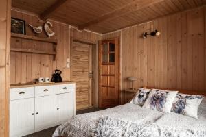 Posteľ alebo postele v izbe v ubytovaní Apartamenty u Lolka