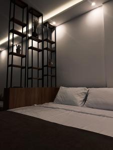 a bedroom with a bed with lights on the wall at Mokoš apartman, Residence hill A35, minimum dve noći in Kopaonik