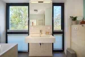 Koupelna v ubytování Ferienhaus Backsteinquartier B Putbus + 14 fotografií