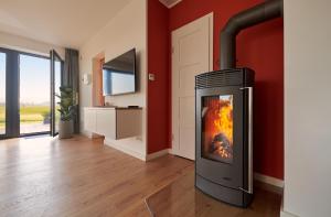 TV a/nebo společenská místnost v ubytování Ferienhaus Backsteinquartier B Putbus