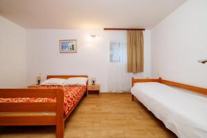 Postel nebo postele na pokoji v ubytování DRAGAN
