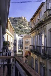 a view from a balcony of buildings with a mountain in the background at Estudio Alicante Barrio 2 in Alicante