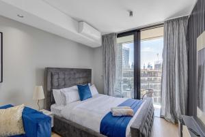 a bedroom with a bed and a large window at Bhonsane Executive Suite, Ellipse, Midrand in Midrand +39 photos