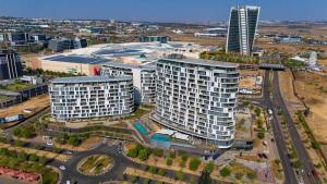 an aerial view of a city with tall buildings at Bhonsane Executive Suite, Ellipse, Midrand in Midrand